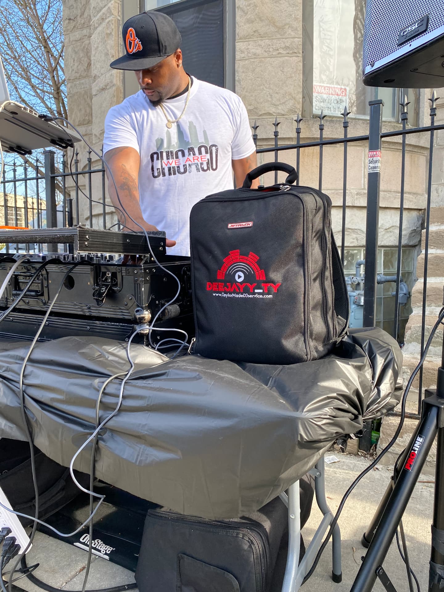 DJ setting up music at a community block event