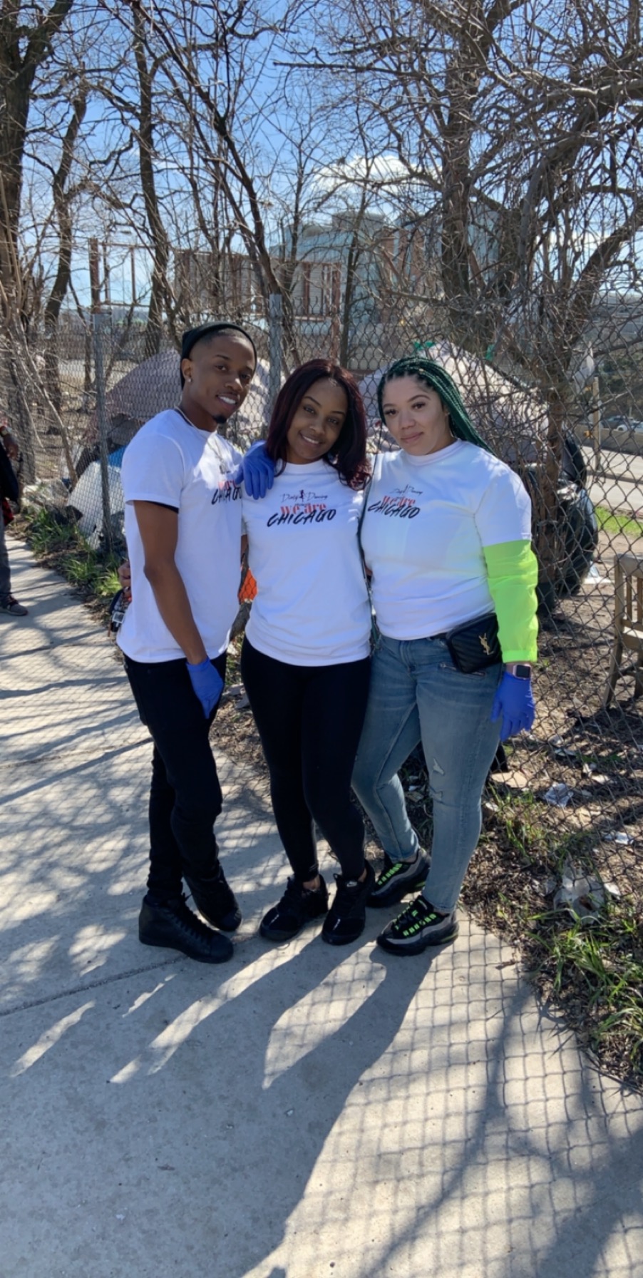 Three outreach volunteers in We Are Chicago shirts ready for street care
